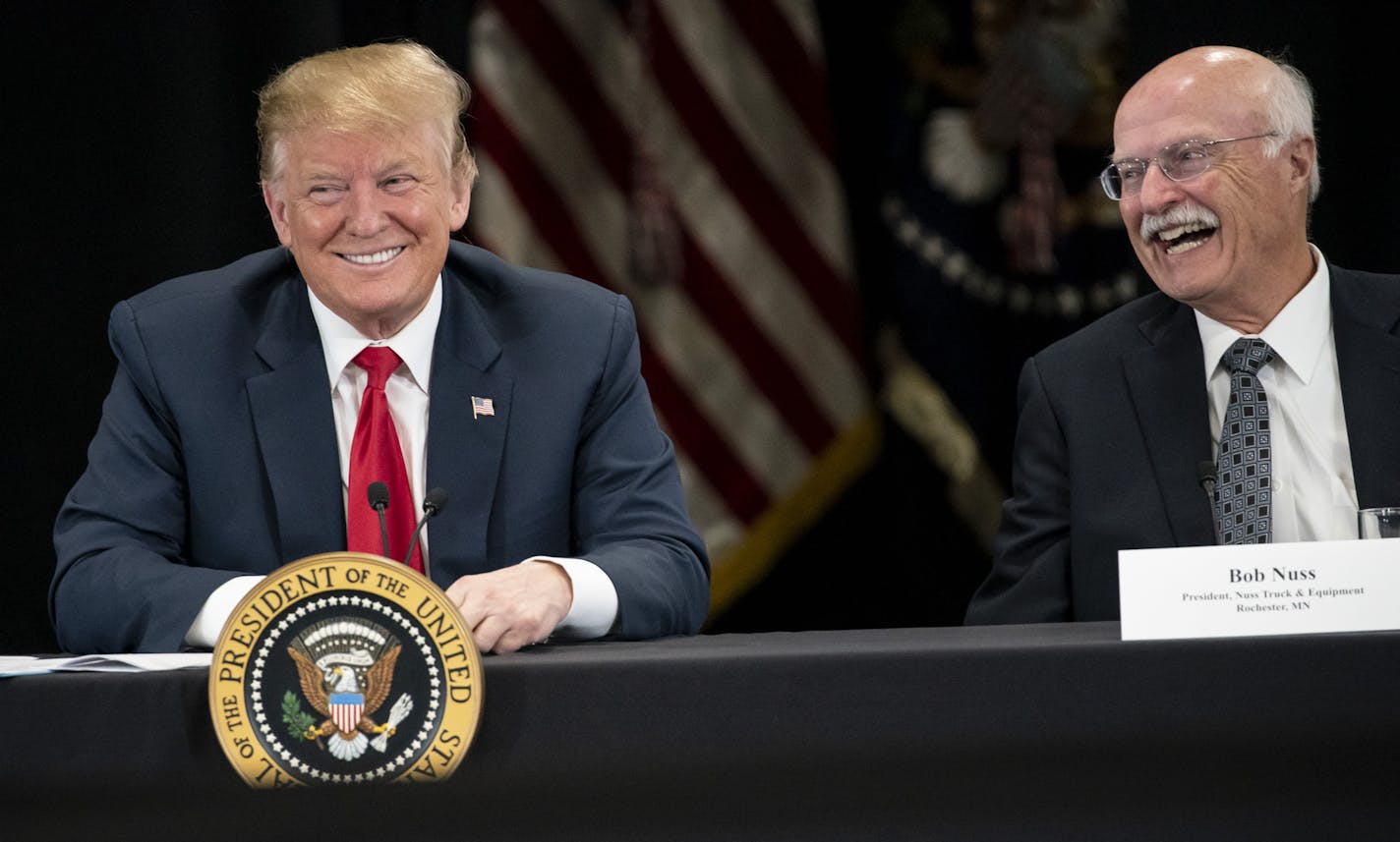 President Donald J. Trump spoke at Nuss Truck and Equipment in Burnsville during a roundtable discussion on tax cuts and the U.S. economy in Burnsville, Minn., on Monday, April 15, 2019. At right is the president of Nuss Truck and Equipment Bob Nuss. ] RENEE JONES SCHNEIDER &#xa5; renee.jones@startribune.com