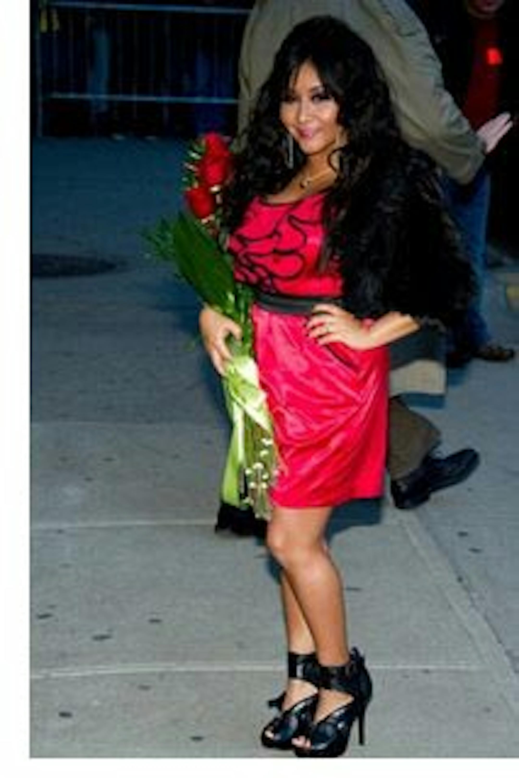 FILE - Nicole 'Snooki' Polizzi leaves a taping of the "Late Show with David Letterman" in New York, in this Jan. 10, 2011 file photo. The Rutgers University Programming Association paid Nicole "Snooki" Polizzi of the reality TV show "Jersey Shore" $32,000 Thursday March 31, 2011 to dish on her hairstyle, fist pumps, as well as the GTL _ gym, tanning, laundry_ lifestyle. That's $2,000 more than the $30,000 the university is paying Nobel-winning novelist Toni Morrison to deliver Rutgers' commencement address in May. (AP Photo/Charles Sykes, File)