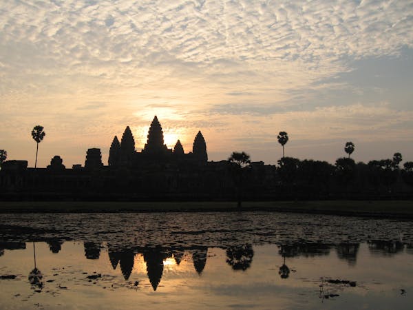 The conical shaped towers of Angkor Wat compete with the sun for a high point in the sky. Visitors to Angkor Wat in Siem Reap, Cambodia, will rarely f