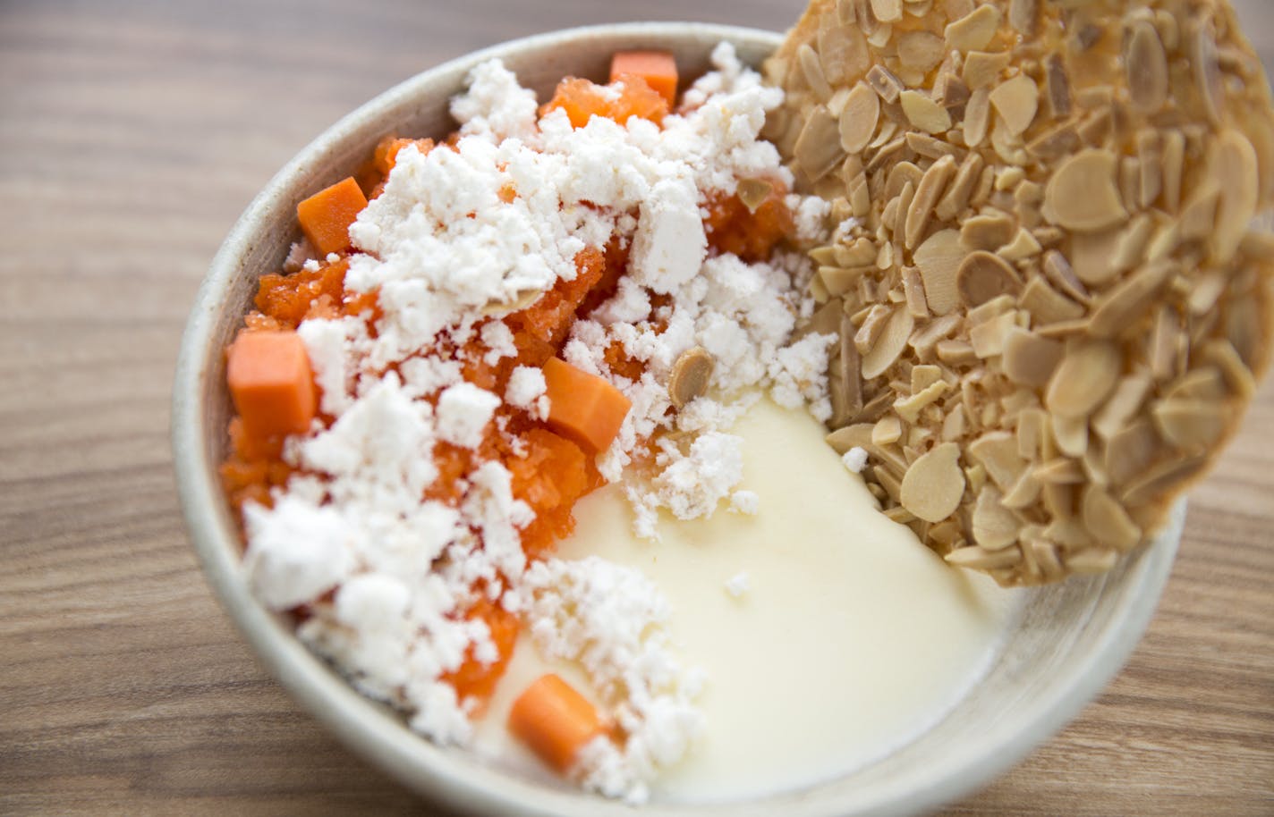 Juniper bavarois with carrot granit&#xe9; and an almond cookie.