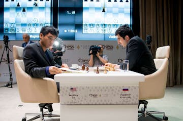 Wesley So, left, prepares for his second-round game against former world chess champion Vladimir Kramnik at the Gashimov Memorial tournament in Shamki