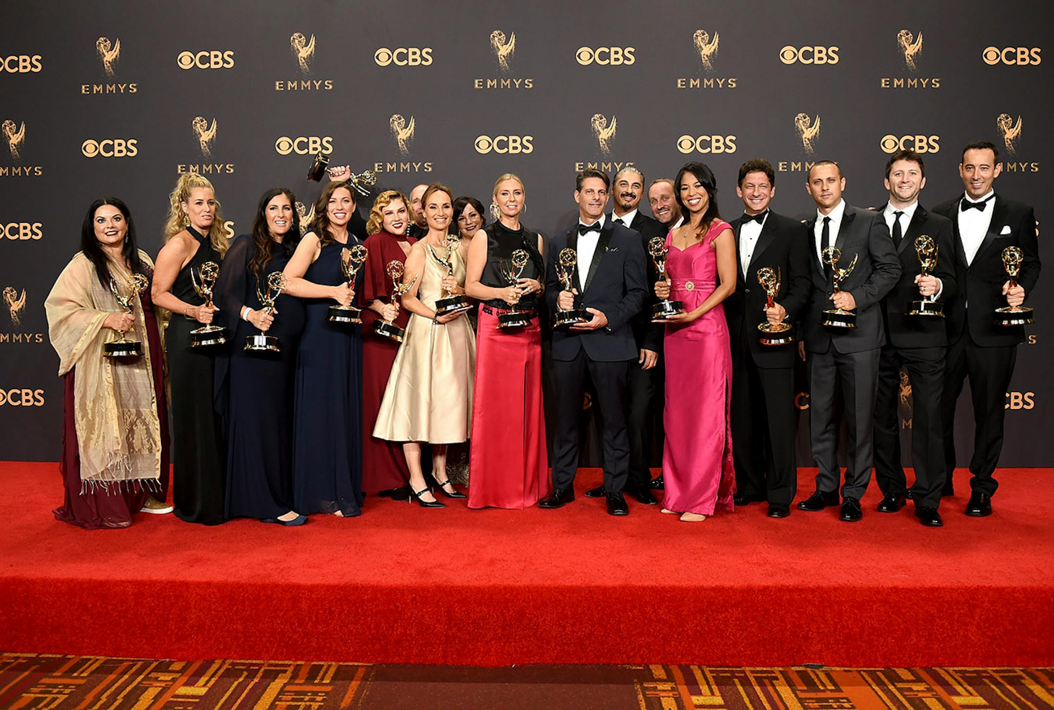 The cast and crew of "The Voice" pose in the press room with their awards for outstanding reality-competition program at the 69th Primetime Emmy Awards on Sunday, Sept. 17, 2017, at the Microsoft Theater in Los Angeles.