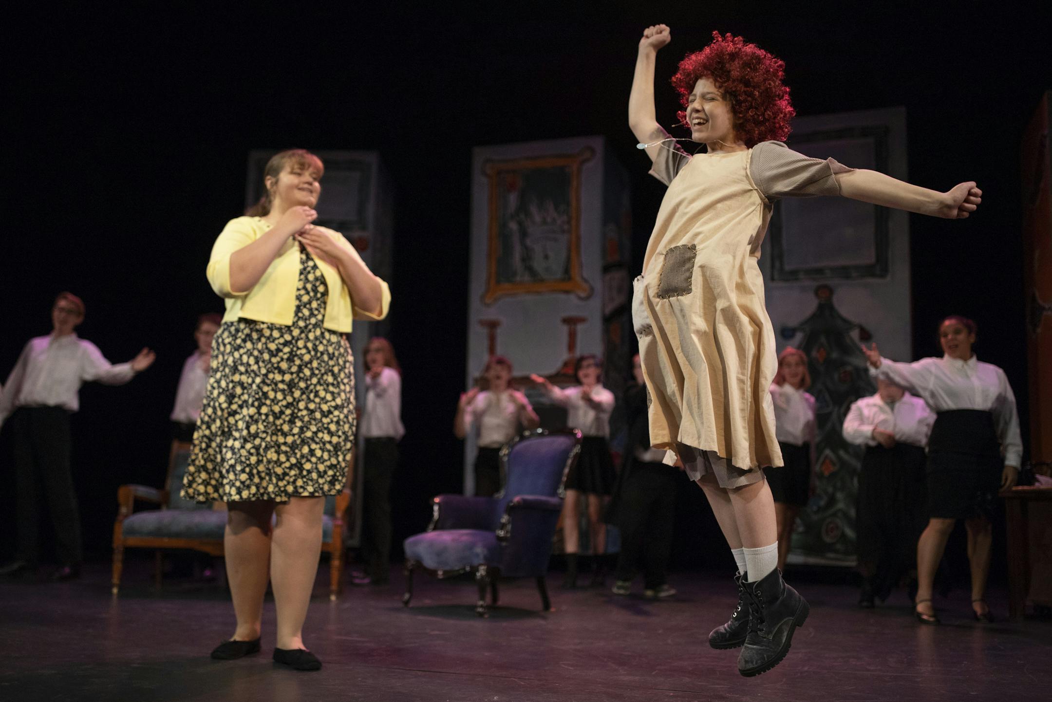 Karrighan Hexum, right, as Annie in a scene with Alyssa Hannan as Grace Farrell during rehearsal Wednesday night, Aug. 1, 2018. The Penguin Project, a nonprofit that "empowers children with special needs through theatre" is behind a Northern Starz Children's Theatre production of "Annie Jr." The cast of special needs kids and their mentors held a dress rehearsal Wednesday night, August 1, 2018 at Anoka Ramsey Community College in Coon Rapids.