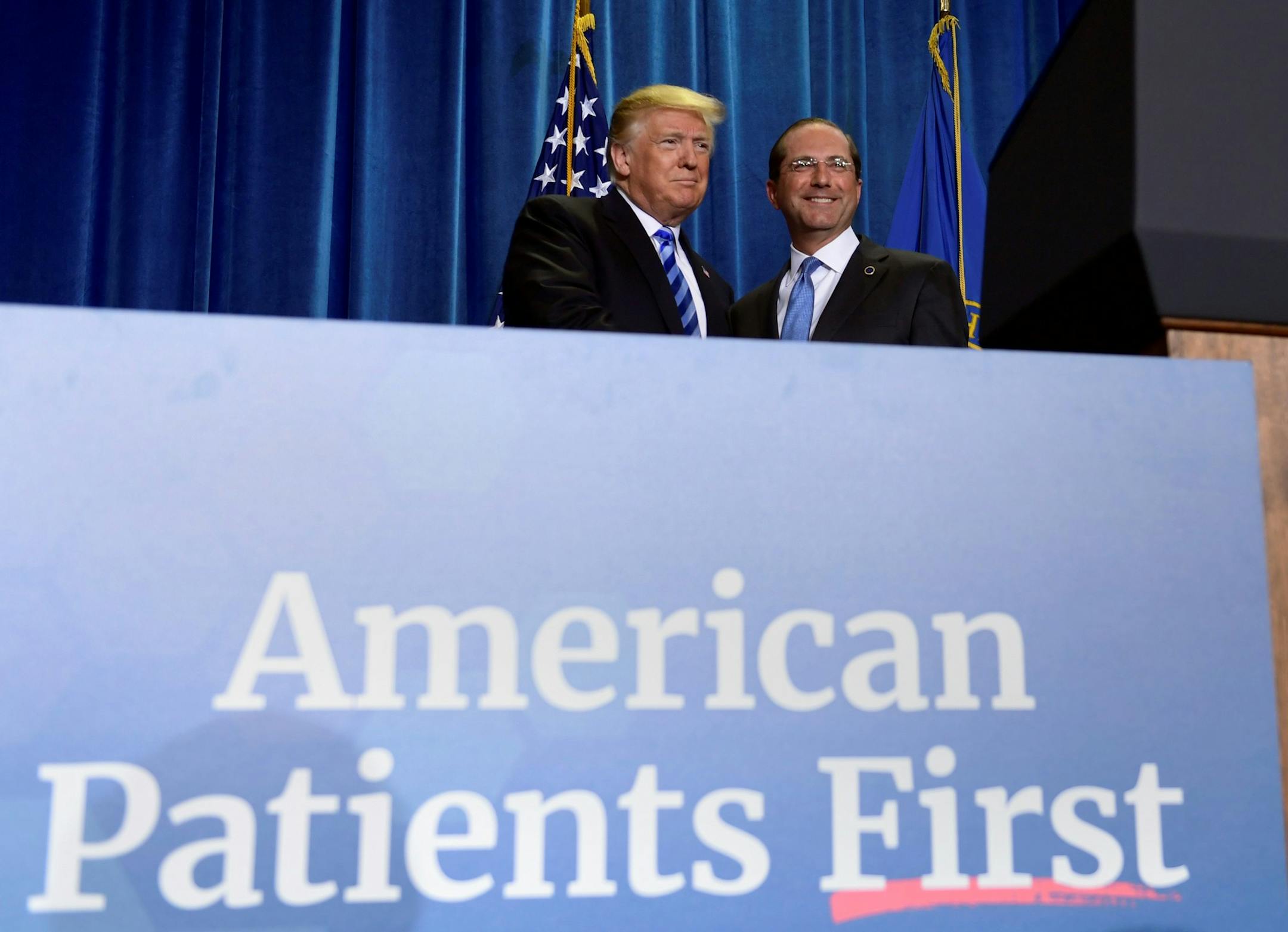 President Donald Trump stands with Secretary of Health and Human Services Alex Azar as he arrives to talk about drug prices during a visit to HHS in Washington, Thursday, Oct. 25, 2018. (AP Photo/Susan Walsh_ ORG XMIT: DCSW203