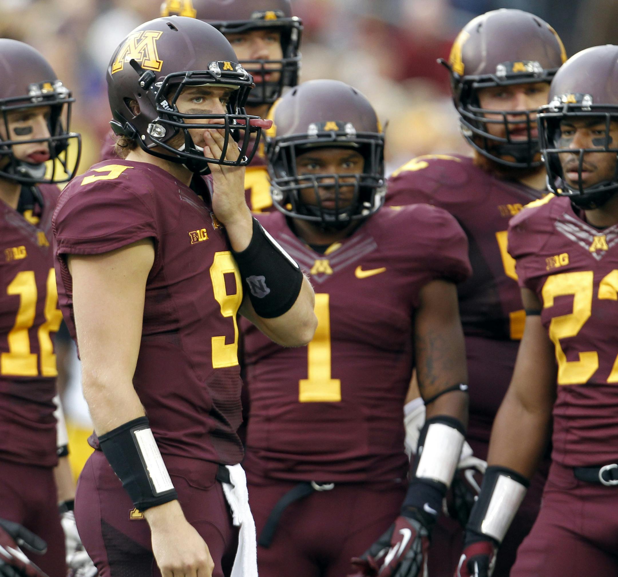 Minnesota quarterback Philip Nelson (9) looks to the bench for guidance during the fourth quarter of an NCAA college football game against Iowa on Saturday, Sept. 28, 2013, in Minneapolis. Iowa beat Minnesota 23-7. (AP Photo/Ann Heisenfelt) ORG XMIT: MNAH109