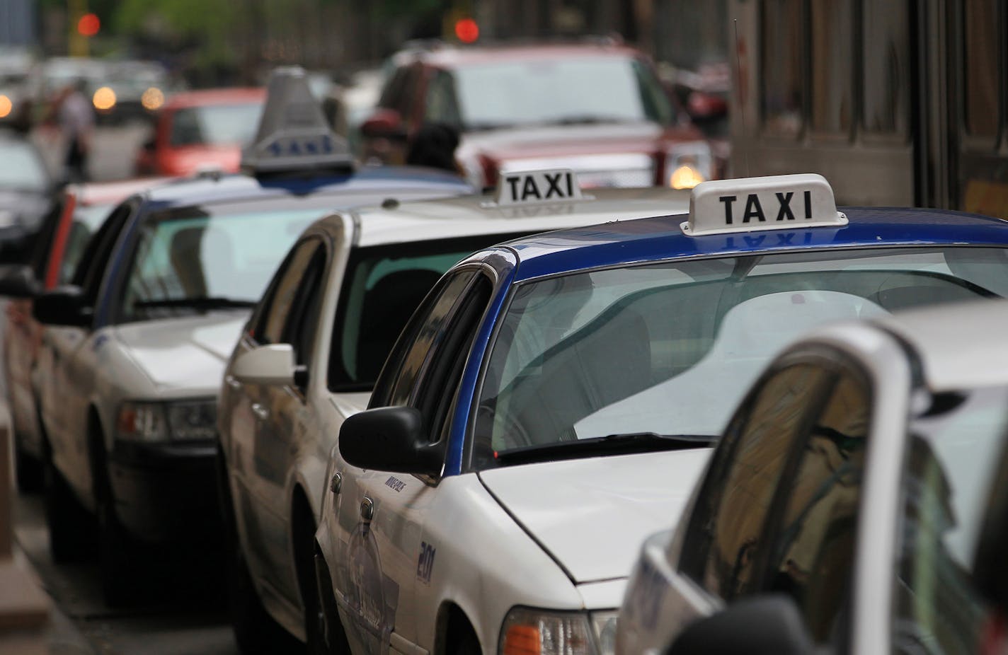 Taxi cabs lined the streets at taxi waiting areas in downtown Minneapolis on Friday, May 4, 2012 in Minneapolis, Minn. The number of cabs has doubled since 2007. ] (RENEE JONES SCHNEIDER/ reneejones@startribune.com) ORG XMIT: MIN2014070210270891