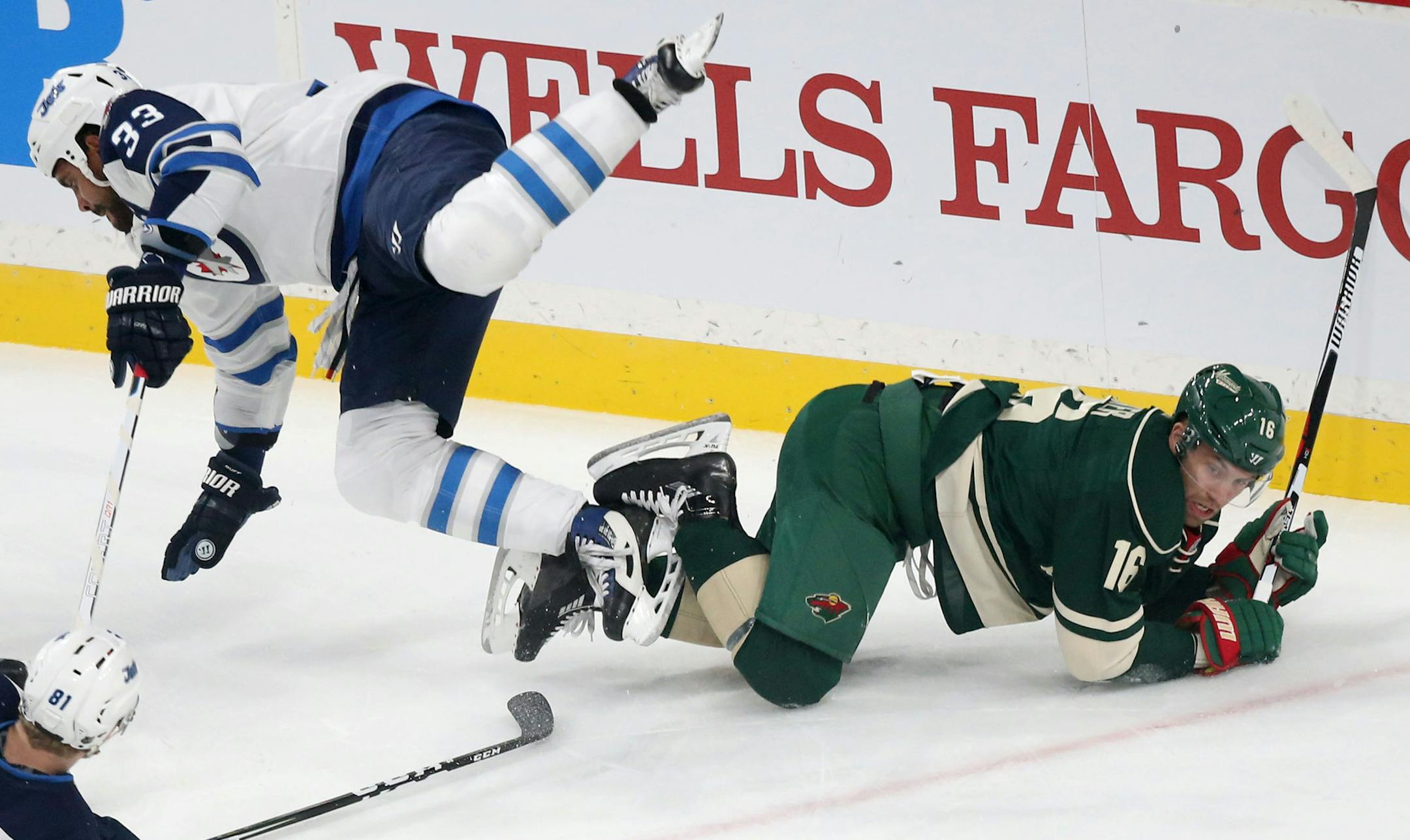 The Minnesota Wild's Jason Zucker (16) and Winnipeg's Dustin Byfuglien (33) collide during the first period of the home opener at the Xcel Energy Center Saturday, Oct. 14, 2016, in St. Paul, MN.](DAVID JOLES/STARTRIBUNE)djoles@startribune.comWild season opener vs. Winnipeg at the Xcel Energy Center Saturday, Oct. 14, 2016, in St. Paul, MN.
