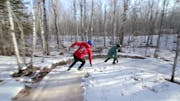 Ice skaters take on the frozen trails of Lester Park in Duluth.