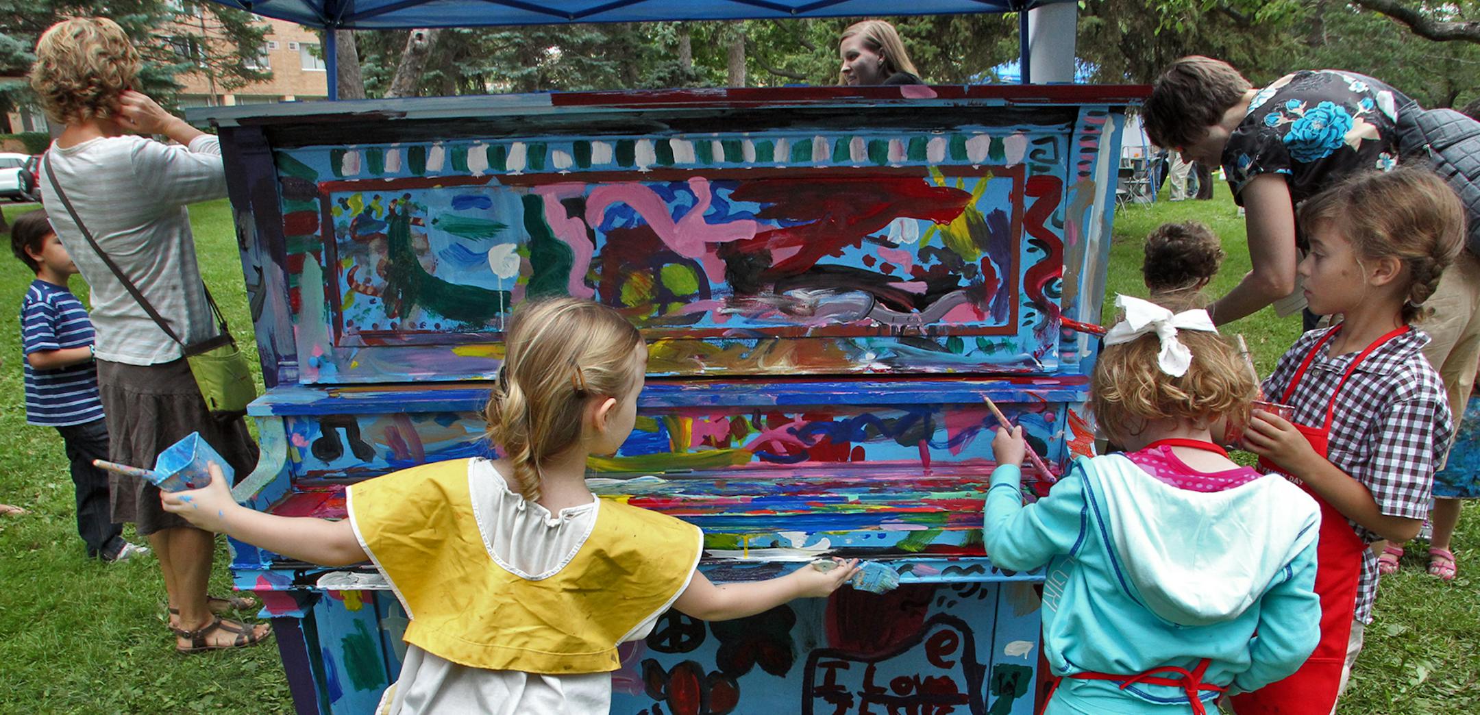 The Minneapolis Institute of Arts held a Family Day and Peace Games event in the museum and in adjacent Washburn Fair-Oaks park. Ethnic dances, balloon sculptures, furniture painting and interior/exterior designing were all on the program of events. Children painted an upright piano donated to the art institute as part of an arts project in the park. (MARLIN LEVISON/STARTRIBUNE(mlevison@startribune.com (cq ) ORG XMIT: MIN1208121558020762