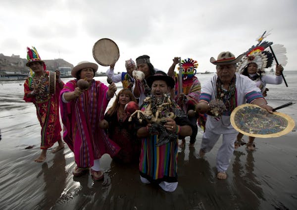 Peruvian shamans perform a ritual against the alleged 2012 apocalyptic Mayan prediction in Lima, Peru, Thursday, Dec. 20, 2012. The supposed 5 a.m. Fr