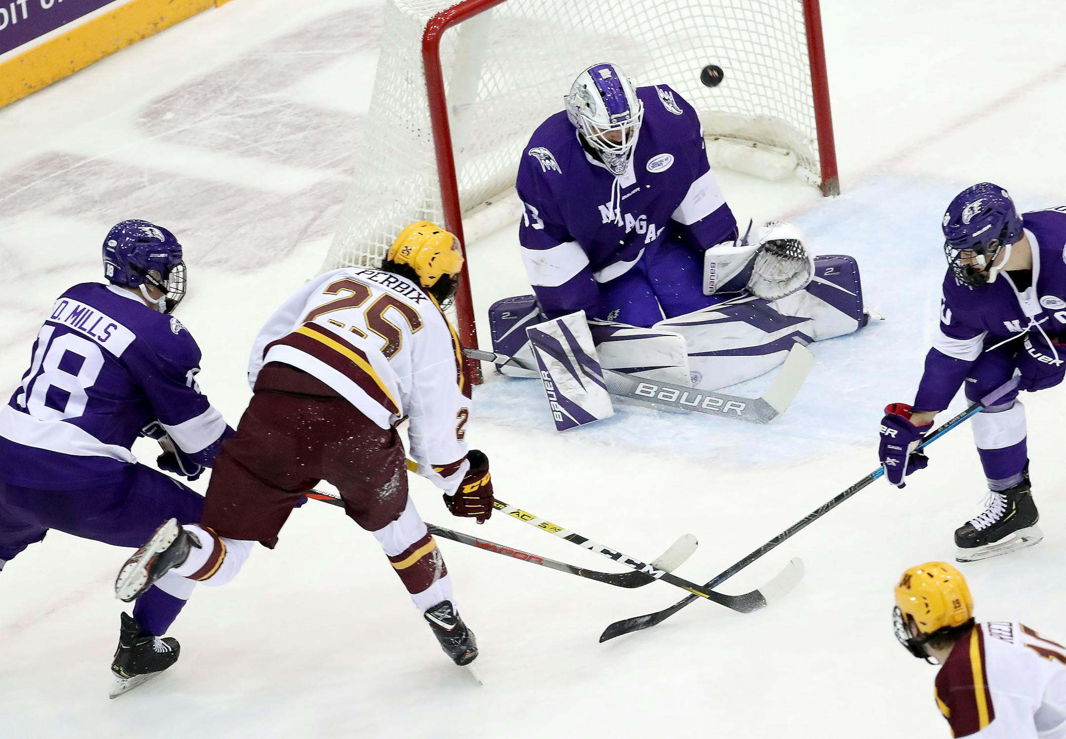Jack Perbix put a shot on Niagara goaltender Brian Wilson during Friday night's game. The Gophers swept the weekend series.
