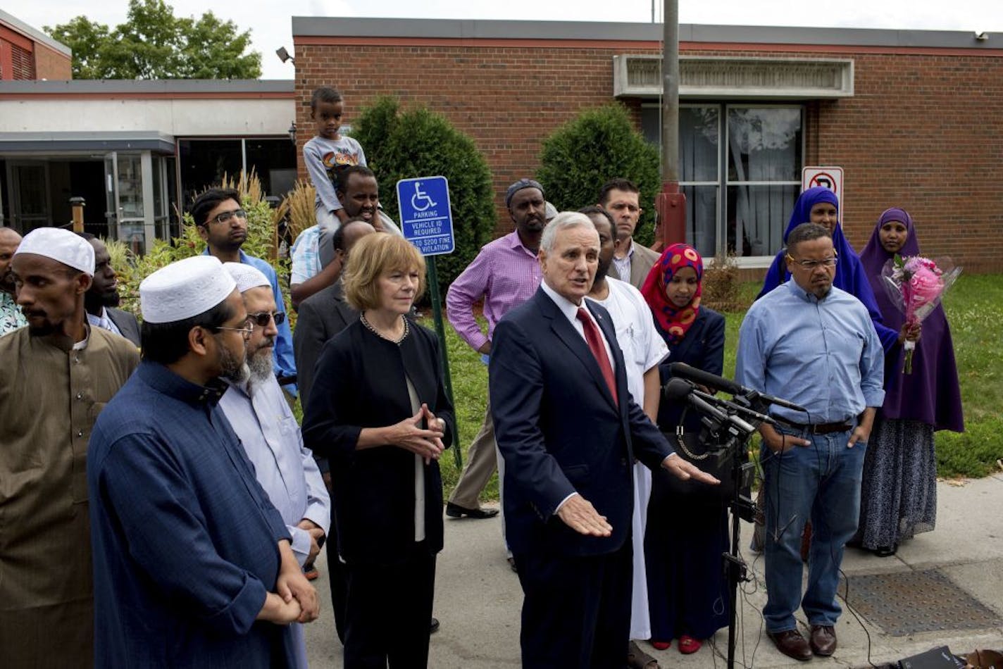 Minnesota Gov. Mark Dayton speaks at a news conference at the Dar Al Farooq Islamic Center in Bloomington, Minn., on Sunday, Aug. 6, 2017, where an explosion damaged a room and shattered windows as worshippers prepared for morning prayers early Saturday.