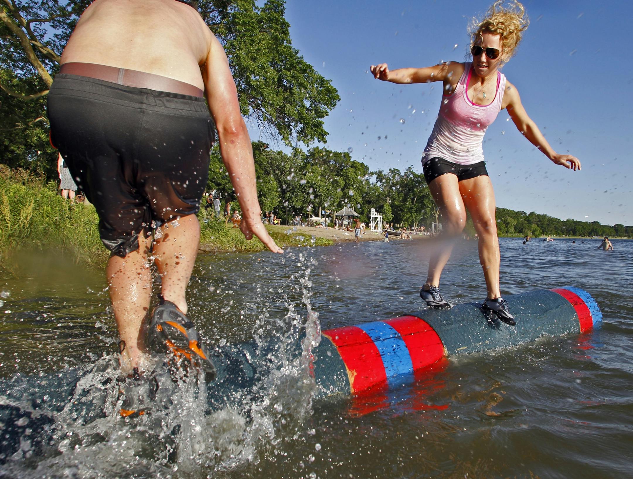 Champion logroller Abbey Hoeschler is trying to bring the offbeat sport of competitive logrolling to the Twins Cities, offering classes to adults and youth. Hoeschler, right, competed with one of her adult students, Jonathan Trent of Minneapolis.