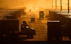 Workers drive among shipping containers and trailers at a BNSF intermodal terminal, Jan. 3, 2024, in Edgerton, Kan. On Wednesday, Feb. 28, 2024, the g