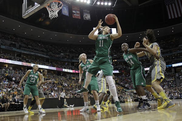 Notre Dame forward Natalie Achonwa (11) pulls in a rebound during the first half in the NCAA Women's Final Four college basketball championship game a
