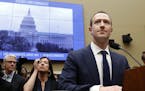 Facebook CEO Mark Zuckerberg returns after a break to continue testifying at a House Energy and Commerce hearing on Capitol Hill in Washington, Wednes