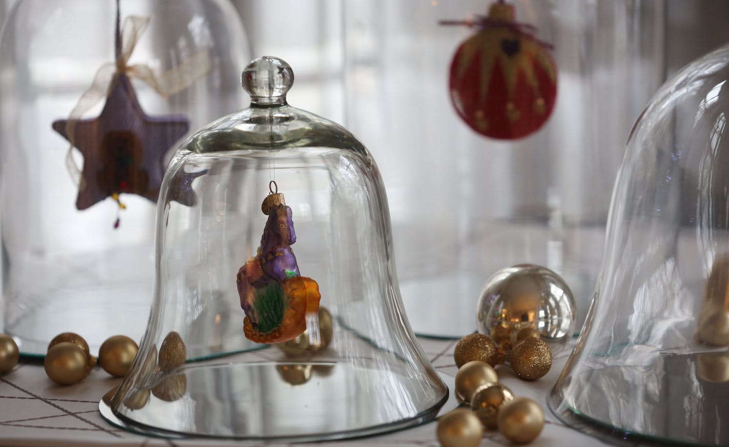 Interior Designer Lisa Peck of Lilu Interiors, kept sentimental ornaments under glass to add a festive touch in her home in Minneapolis, Thursday, November 20, 2013. ] (KYNDELL HARKNESS/STAR TRIBUNE) kyndell.harkness@startribune.com