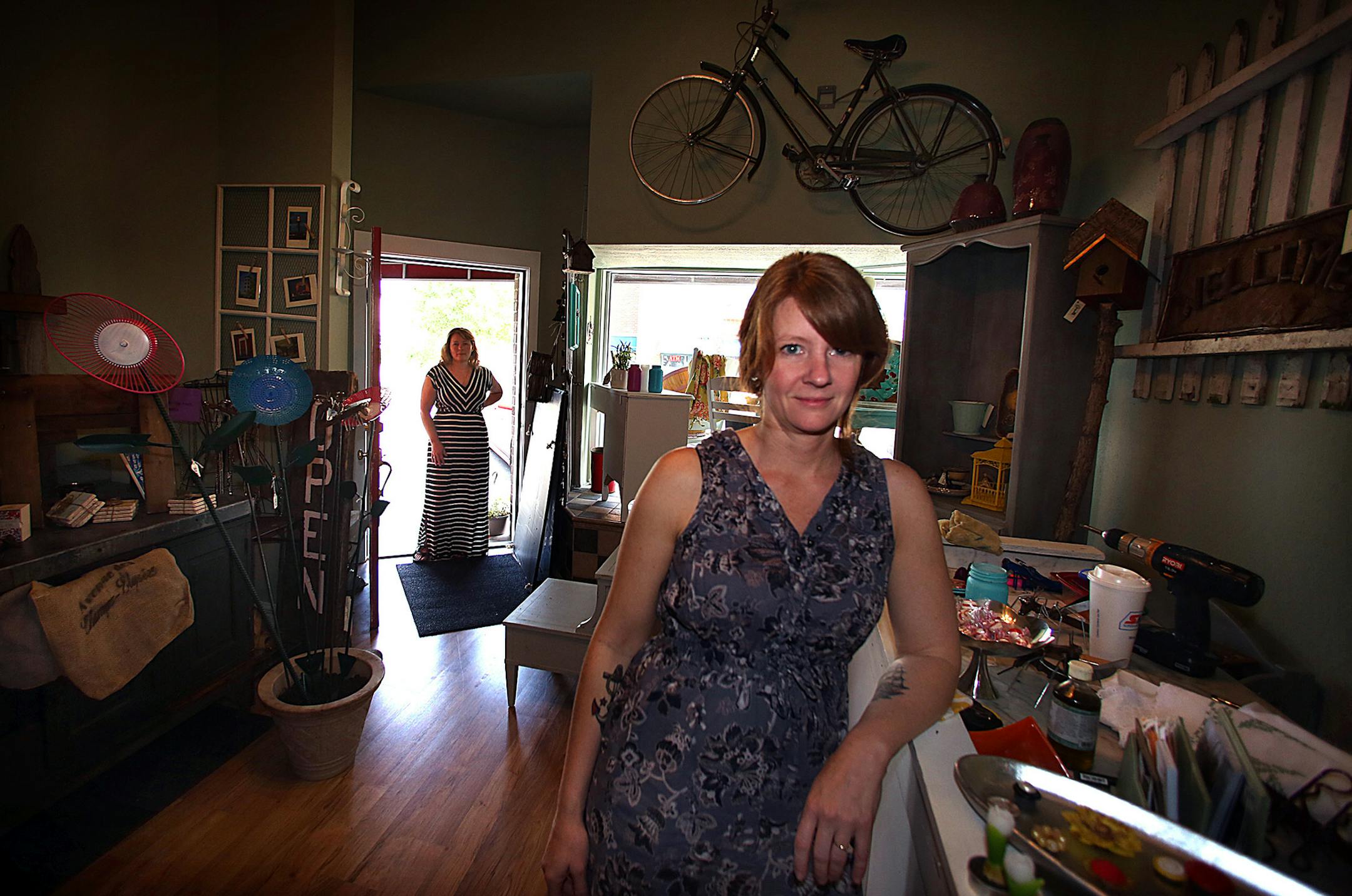 Sisters Kim (left) and Sarah Lindgren are owners and designers of Amour Cru, a furniture and vintage store in downtown Shakopee. ] JIM GEHRZ ‚Ä¢ jgehrz@startribune.com / Shakopee, MN / July 10, 2014 / 10:00 AM / BACKGROUND INFORMATION: ‚ÄúEvery woman who rides a motorcycle is sexy!‚Äù Inessa Hansen declares. Hansen is about to open a shop in downtown Shakopee called One Sexy Biker Chick and become part of a remarkable, perhaps unprecedented, tur