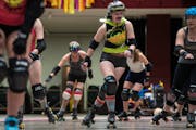 Alex Kempf-Schwarze, derby name "Major Threat," skates around the loop with at practice in the Roy Wilkins Auditorium on Thursday, Nov. 9, 2023 in St.