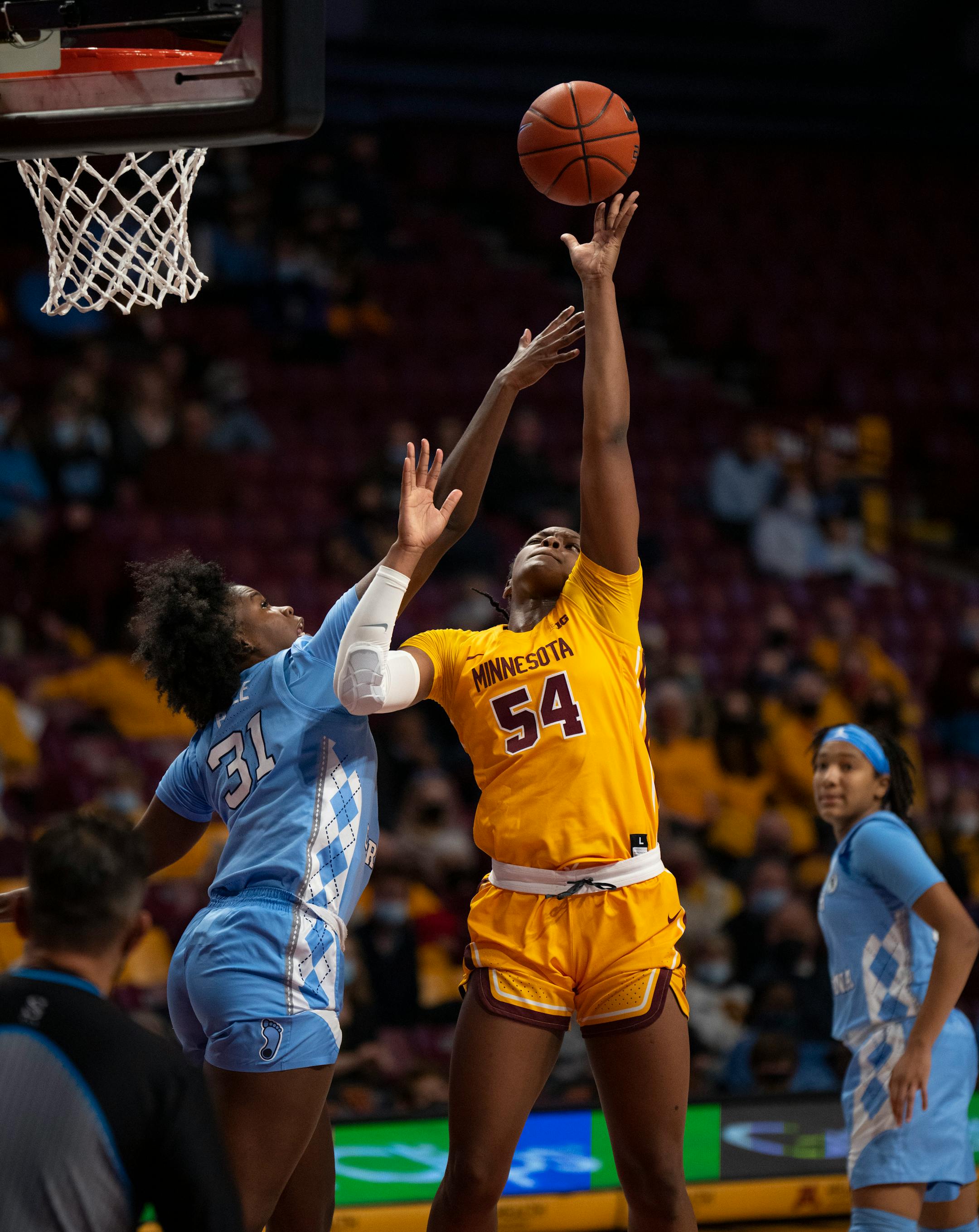 Minnesota Gophers forward Alanna Micheaux (54) shot over North Carolina Tar Heels forward Anya Poole (31) in the third quarter on her way to scoring a game high 23 points Wednesday, Dec. 1, 2021 at Williams Arena in Minneapolis. The University of Minnesota women's basketball team lost to the University of North Carolina 82-76 in an NCAA basketball game Wednesday, Dec. 1, 2021 night at Williams Arena in Minneapolis. ] JEFF WHEELER • Jeff.Wheeler@startribune.com