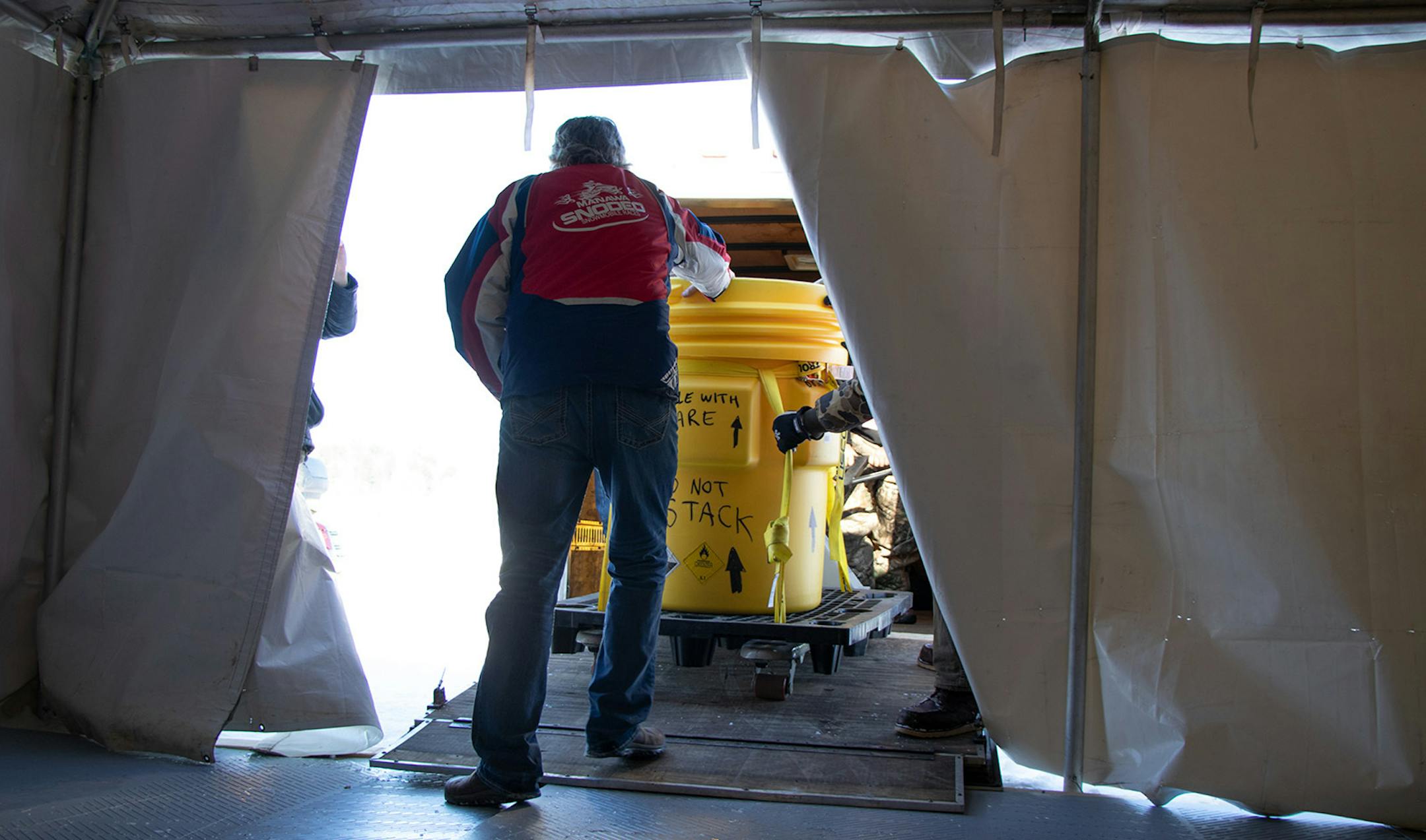 Kurt Anderson wheels a container of rocket fuel into the Arctic Arrow�s prep tent before fueling on Sunday, Feb. 16, 2020 on Bear Lake in Manawa, WI.