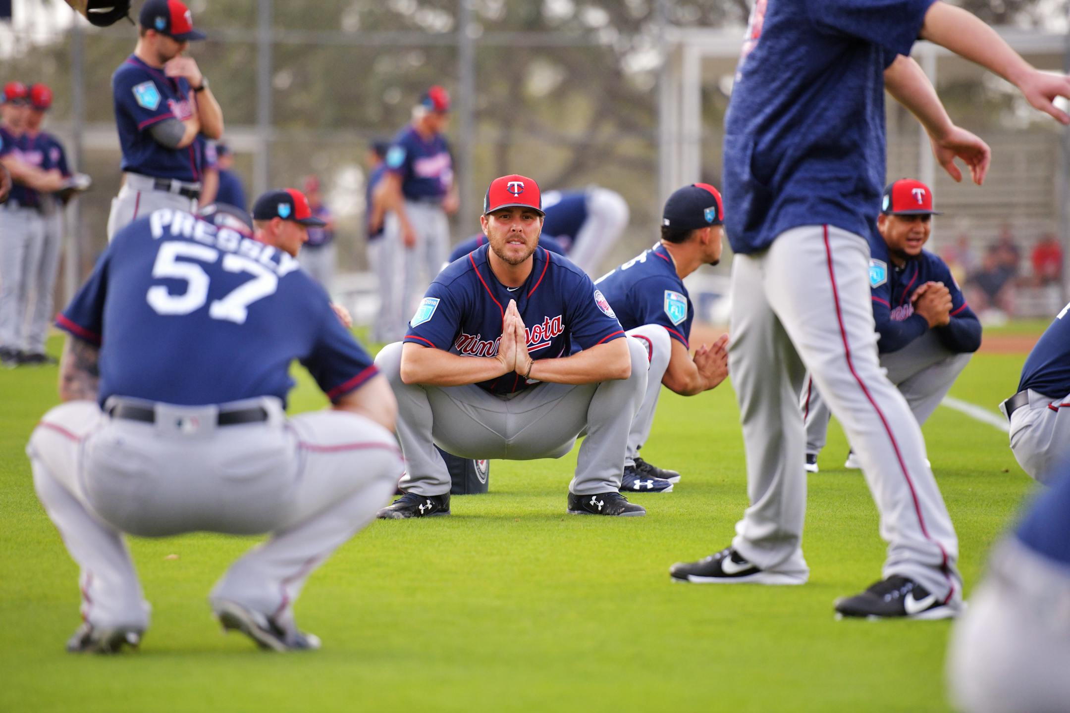 Twins pitcher Michael Kohn stretched with teammates on the first day of workouts in Fort Myers