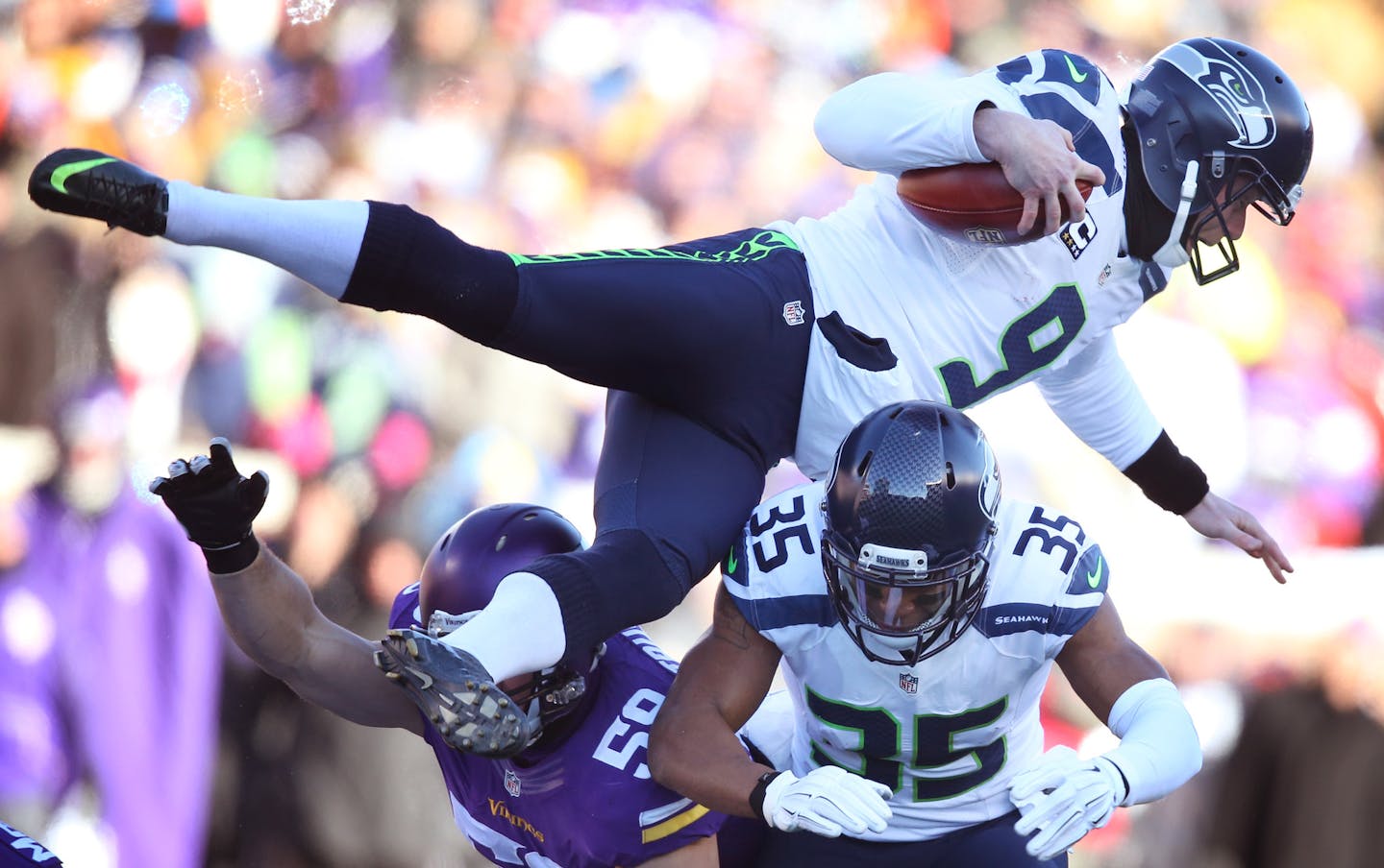 Seattle Seahawks punter Jon Ryan (9) was upended by Vikings Jason Trusnik after picking up a fumble in the first quarter at TCF Bank Stadium Sunday January 10, 2016 in Minneapolis, MN. ] The Seattle Seahawks beat the Minnesota Vikings 10-9 in the first round of the playoffs Sunday at TCF Bank Stadium. Jerry Holt/Jerry.Holt@Startribune.com