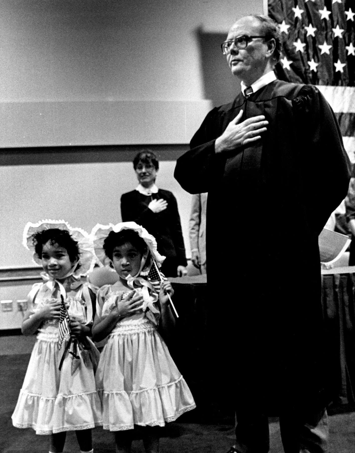 May 5, 1985 Maria and Marissa Hagen, twins adopted from Colombia, helped Judge Donald Alsop lead the group in the Pledge of Allegiance. Duane Braley, Minneapolis Star Tribune ORG XMIT: MIN2014080714054971