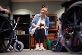 Annie Lees, a chaplain at Catholic Eldercare, leads a rosary and Bible study for residents at Catholic Eldercare in Minneapolis.