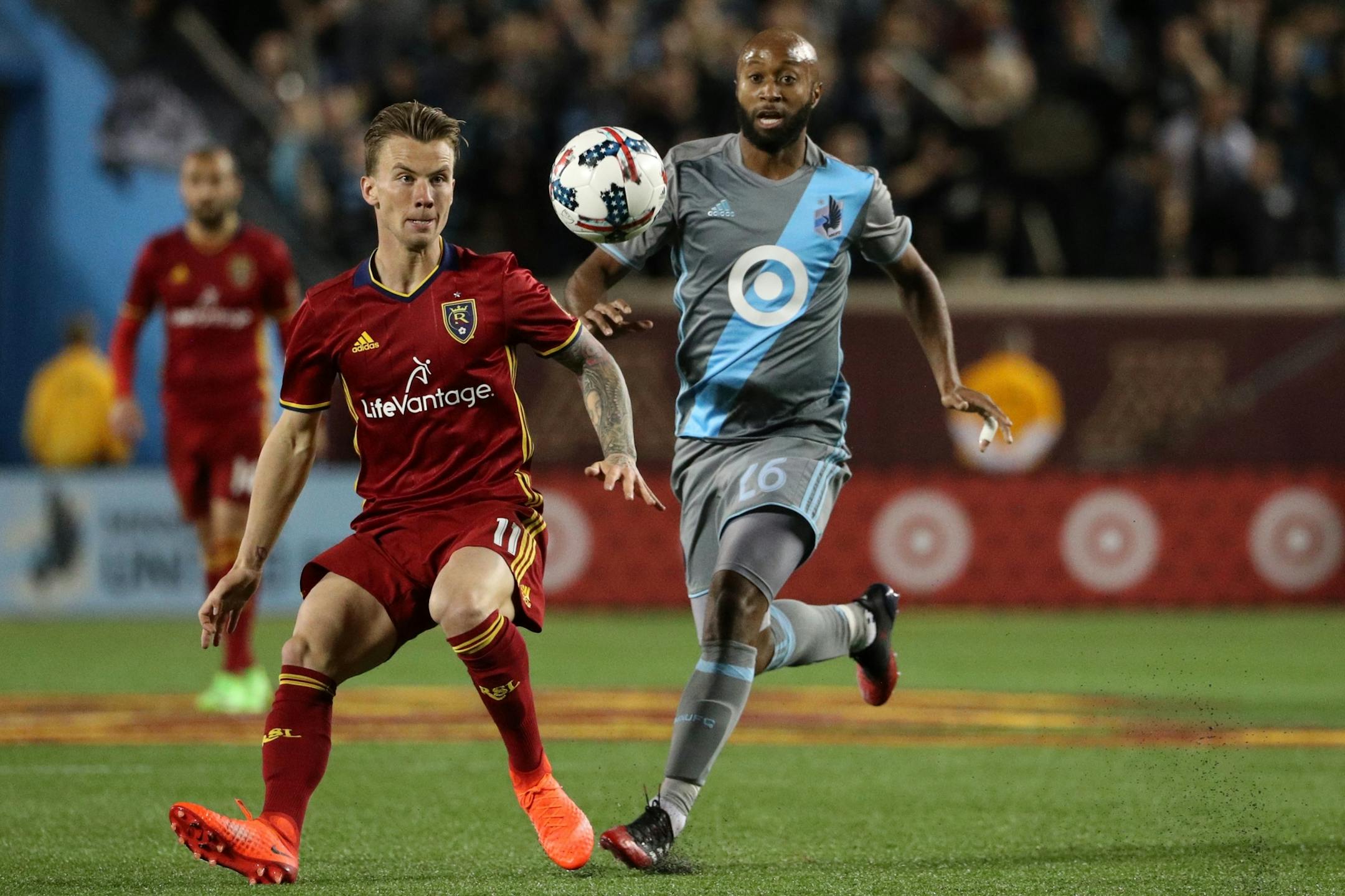 Real Salt Lake midfielder Albert Rusnak (11) raced Minnesota United midfielder Collen Warner (26) for the ball in the second half.