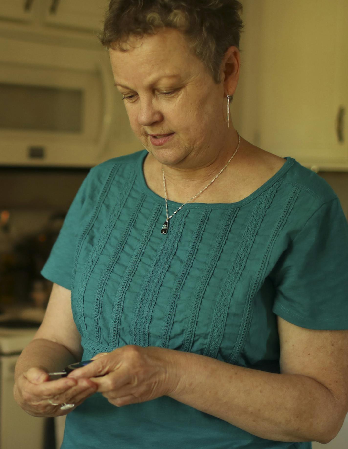 Kim Battern, diabetic and a recent (last week) retiree, checked her blood sugar in the kitchen of her Plymouth home. ] JEFF WHEELER &#xef; jeff.wheeler@startribune.com Kim Battern, diabetic and a recent (last week) retiree, is among those most impacted by the price of insulin more than tripling in the past decade. While drug prices are increasing across the board, the problem hits diabetics hard because it is a chronic lifelong condition. She was photographed at home in Plymouth Wednesday aftern