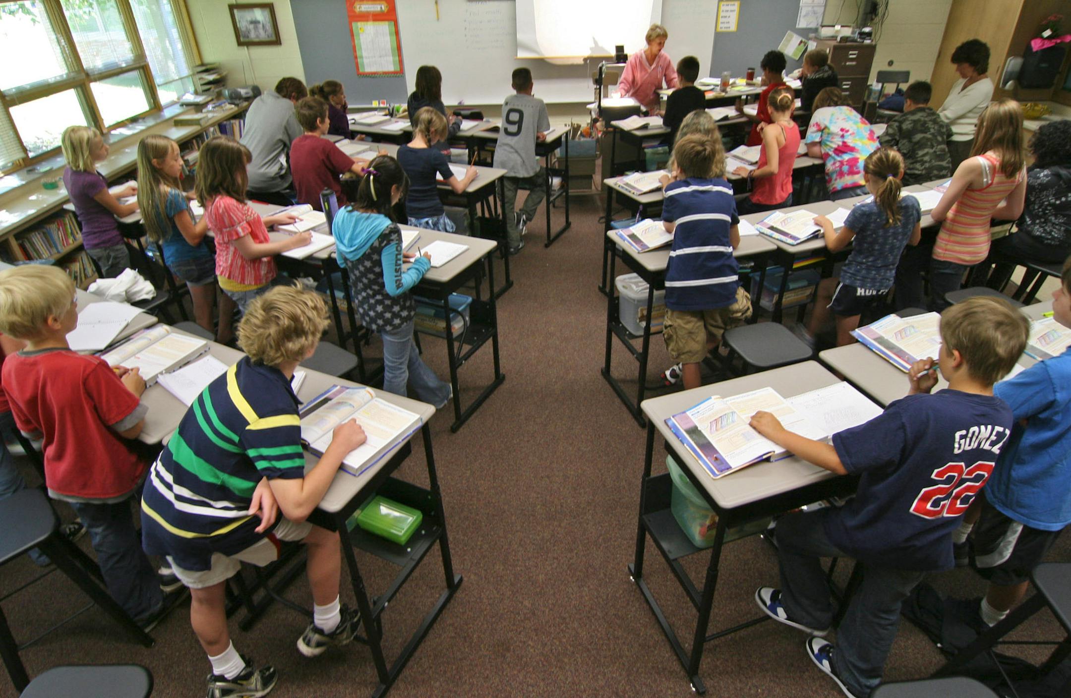 The sixth grade math class taught by Abby Brown uses the standing desks she developed,- adjusted to accomondate different heights,- as do the other classes at Marine Elementary