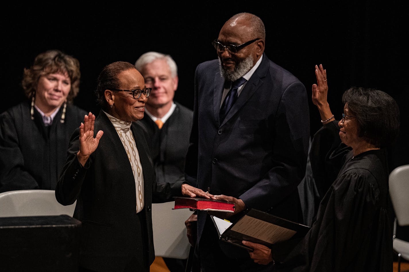 Chief Natalie Hudson with husband Reverend Willie Hudson and Wilhelmina Marie Wright a her side, celebrates her new role as the leader of the Minnesota Supreme Court at the History Center in St. Paul, Minn., on Monday, Nov. 27, 2023. This is the public ceremony for the Minnesota Supreme Court. Chief Natalie Hudson and new associate Karl Procaccini have already been sworn in and are hearing cases.] RICHARD TSONG-TAATARII • richard.tsong-taatarii @startribune.com