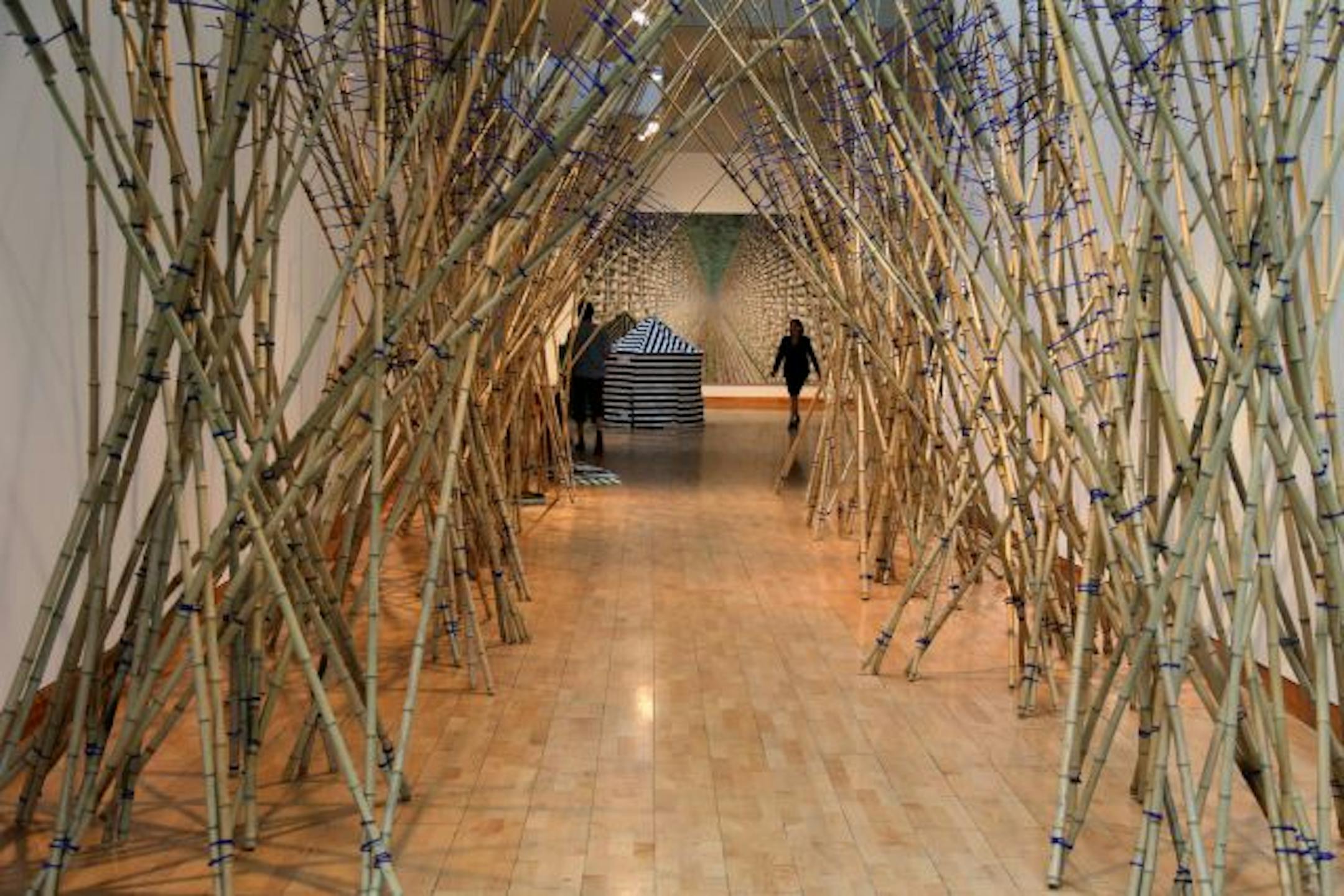 Diane Willow's enticing installation of bamboo rods and twigs opens "Ordinarily Here."