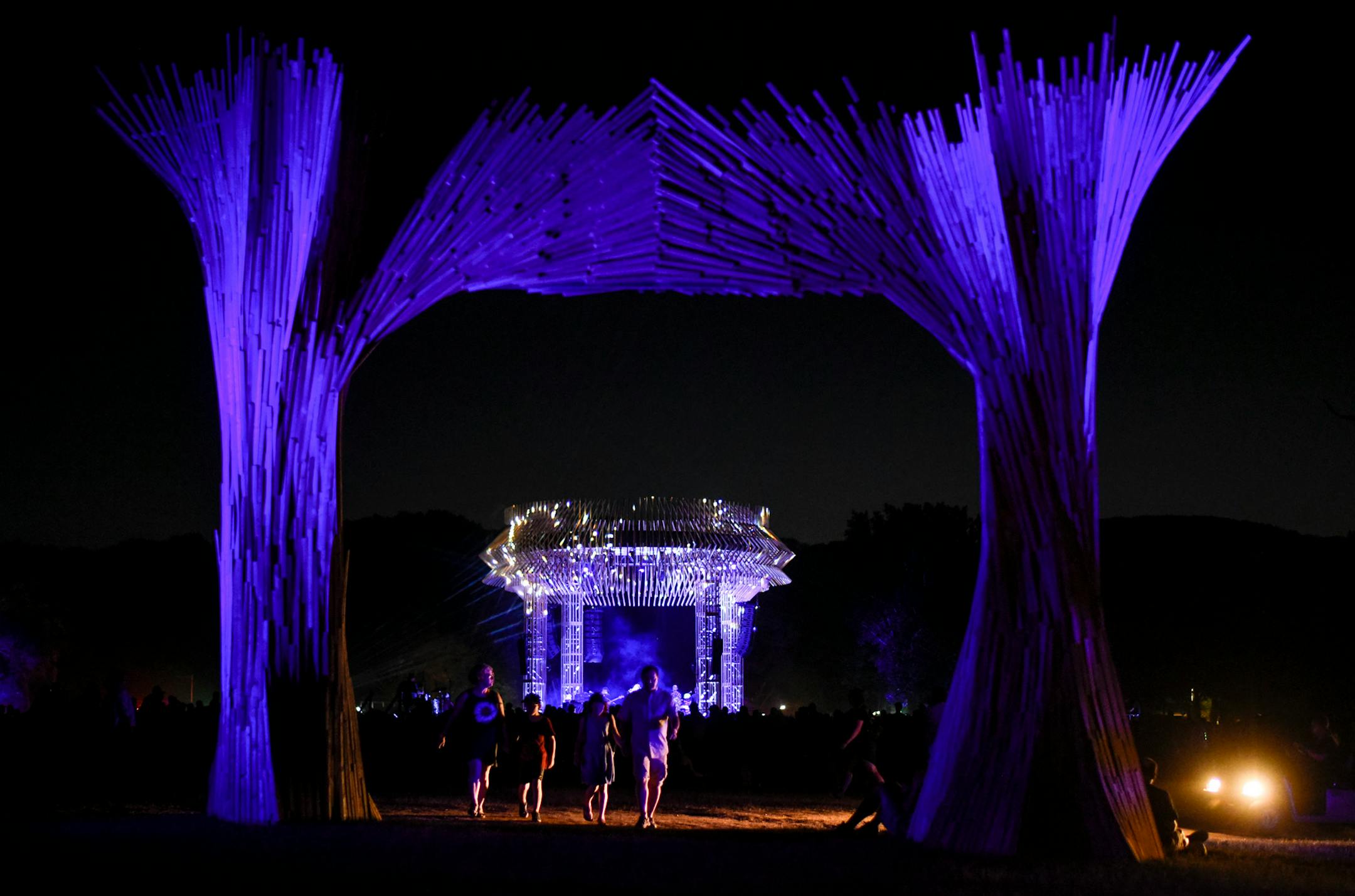 The Flambeaux Stage seen through a sculpture Saturday during The National's performance. ] AARON LAVINSKY ï aaron.lavinsky@startribune.com Day two of the Eaux Claires Music & Art Festival was held Saturday, July 7, 2018 at Foster Farms in Eau Claire, Wisc.