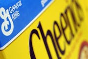 FILE - In this Dec. 15, 2007 file photo, a box of General Mills' Cheerios is seen on a shelf at a Shaw's Supermarket in Gloucester, Mass. General Mill