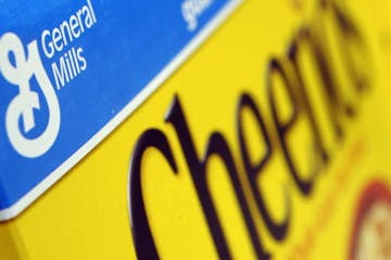 FILE - In this Dec. 15, 2007 file photo, a box of General Mills' Cheerios is seen on a shelf at a Shaw's Supermarket in Gloucester, Mass. General Mill