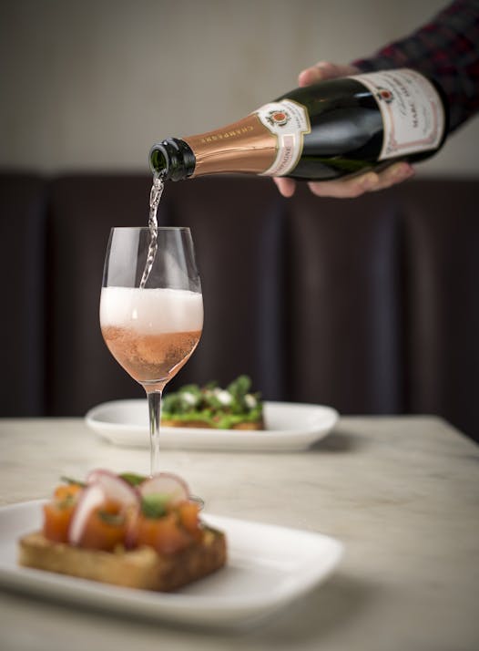 Brown poured a glass of sparkling rosé, one of his favorites.