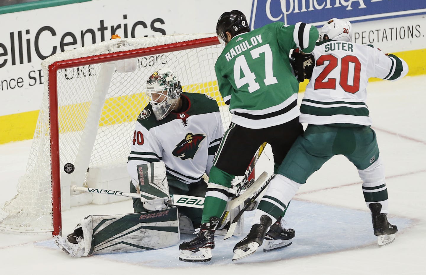 Dallas Stars forward Alexander Radulov (47) scores a goal as Minnesota Wild goaltender Devan Dubnyk (40) and defenseman Ryan Suter (20) defend during the third period of an NHL hockey game Saturday, Feb. 3, 2018, in Dallas. Dallas won 6-1. (AP Photo/Brandon Wade)