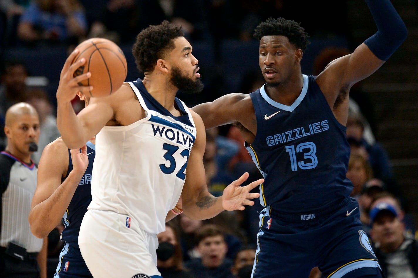 Timberwolves center Karl-Anthony Towns handled the ball against Memphis forward Jaren Jackson Jr. in the first half Thursday.