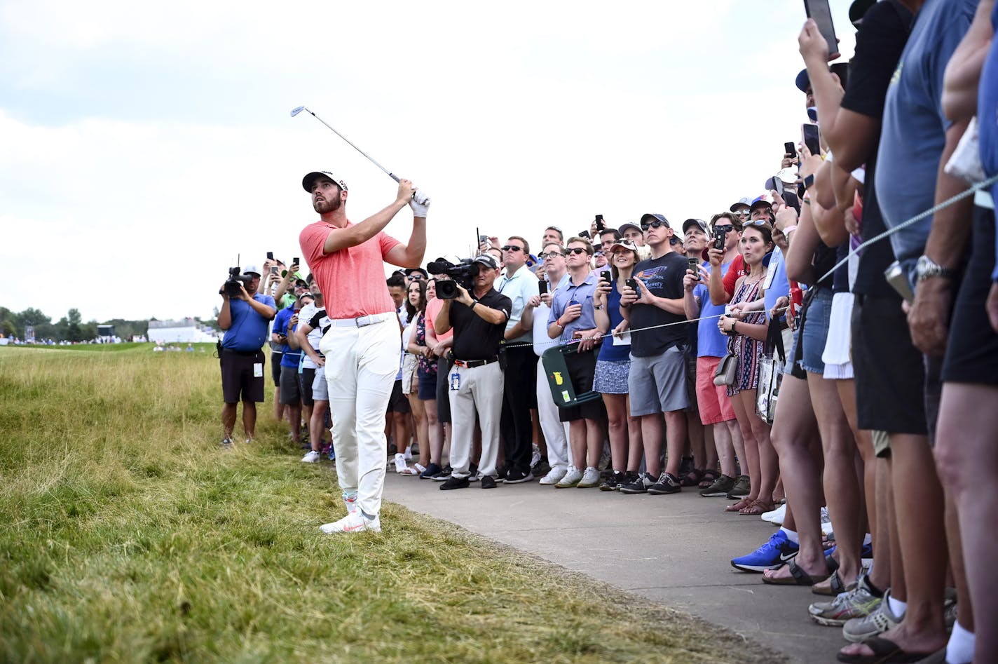 Matthew Wolff hits his ball out of the rough along the side of the 18th hole during the third round of the 3M Open golf tournament in Blaine, Minn., Saturday, July 6, 2019. (Aaron Lavinsky/Star Tribune via AP)