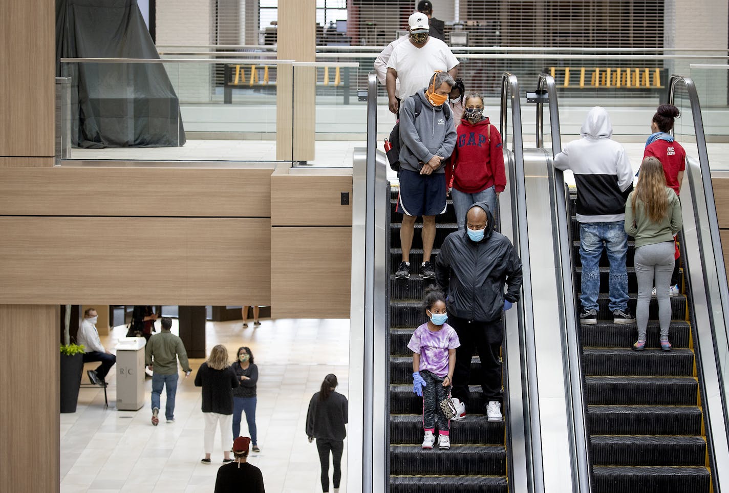 Shoppers made their way through Rosedale Center in Roseville on Monday as some of the stores opened for business.