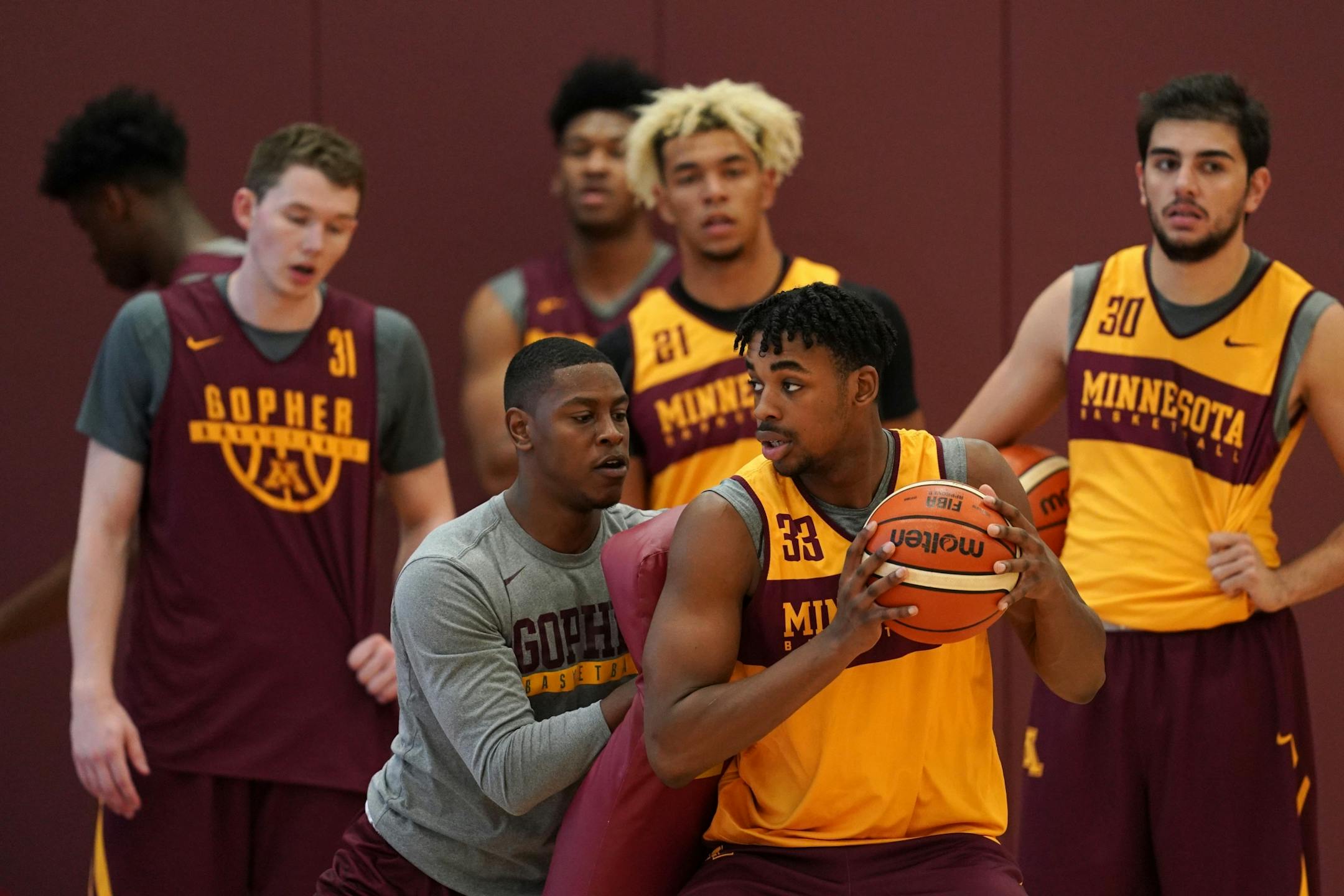 Gophers center Sam Freeman took part in a drill during Thursday's practice.