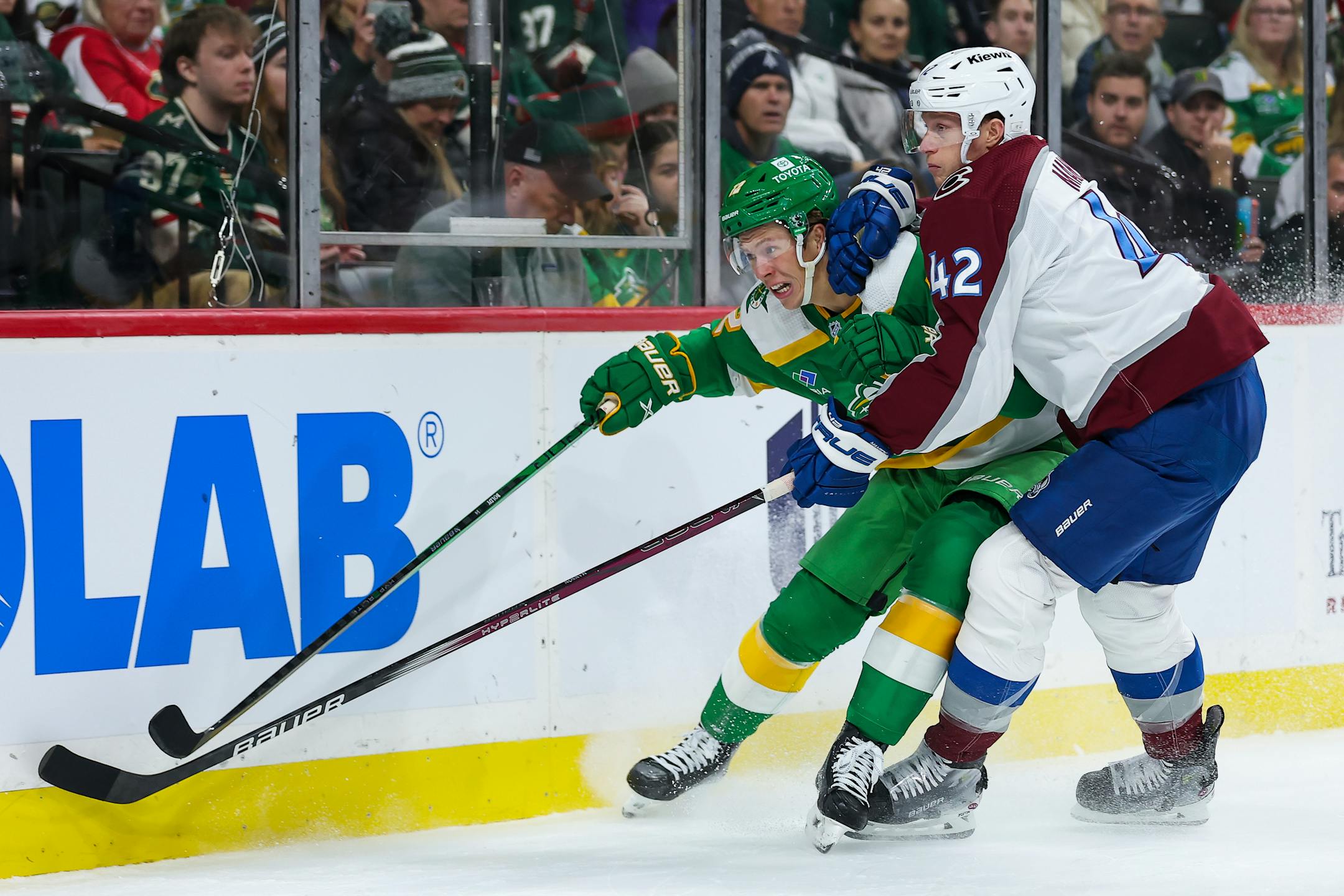 Wild left wing Matt Boldy, left, and Colorado defenseman Josh Manson competed for the puck during the first period Friday.