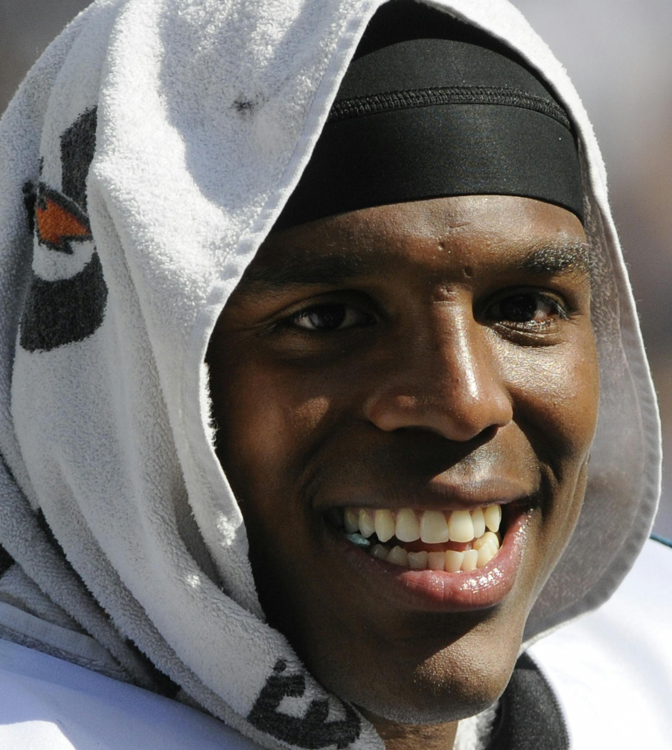 Carolina Panthers quarterback Cam Newton (1) smiles while on the sideline of an NFL football game against the New York Giants in Charlotte, NC Sunday, Sept. 22, 2013. (AP Photo/Mike McCarn) ORG XMIT: _20130922MM3016.JPG