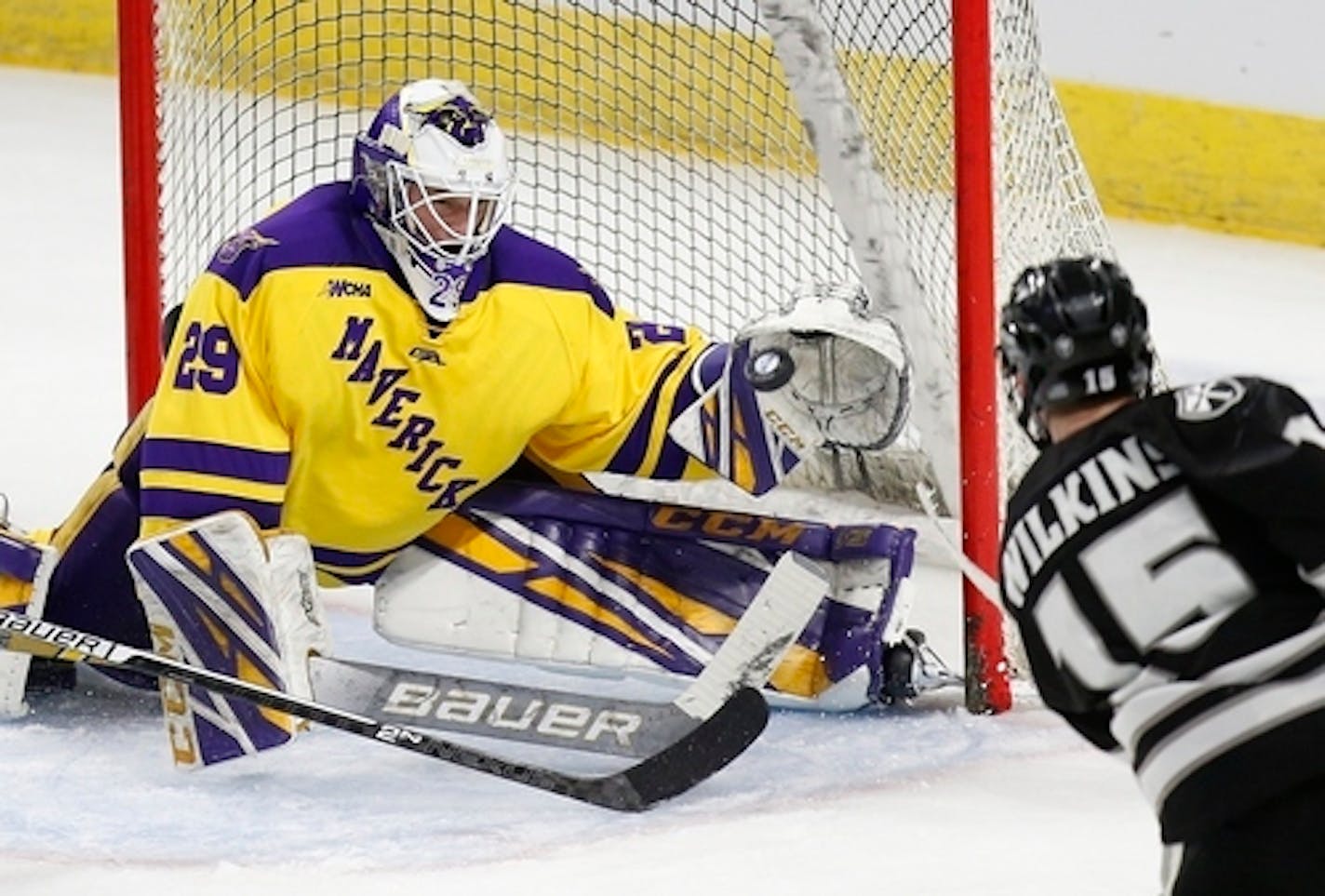 Providence's Josh Wilkins (15) scores on Minnesota State's Dryden McKay (29) during the third period of an NCAA Division I East Regional semifinal men's hockey game in Providence, R.I., Saturday, March 30, 2019. (AP Photo/Michael Dwyer)