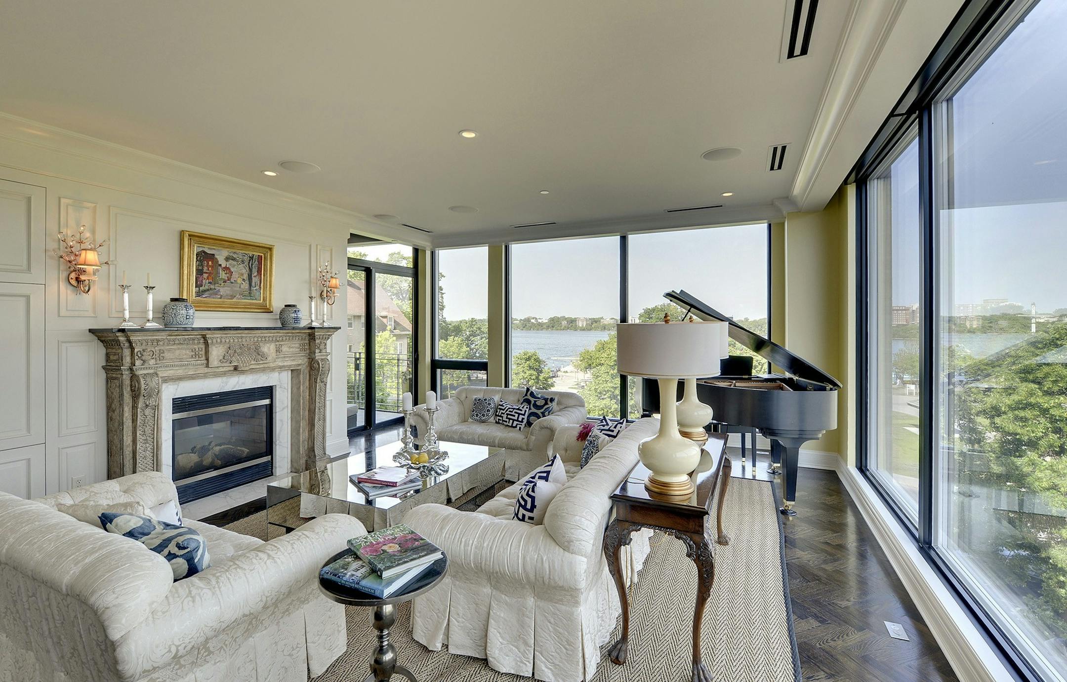 The condo's living room combines traditional touches with modern elements and delivers a panoramic view of Lake Calhoun.