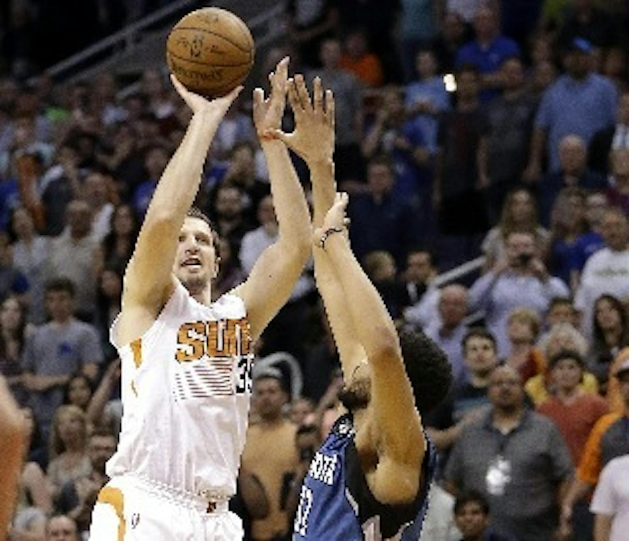 The Suns' Mirza Teletovic made the game-winning three-pointer over Timberwolves center Karl-Anthony Towns, giving Phoenix a 107-104 victory Monday.