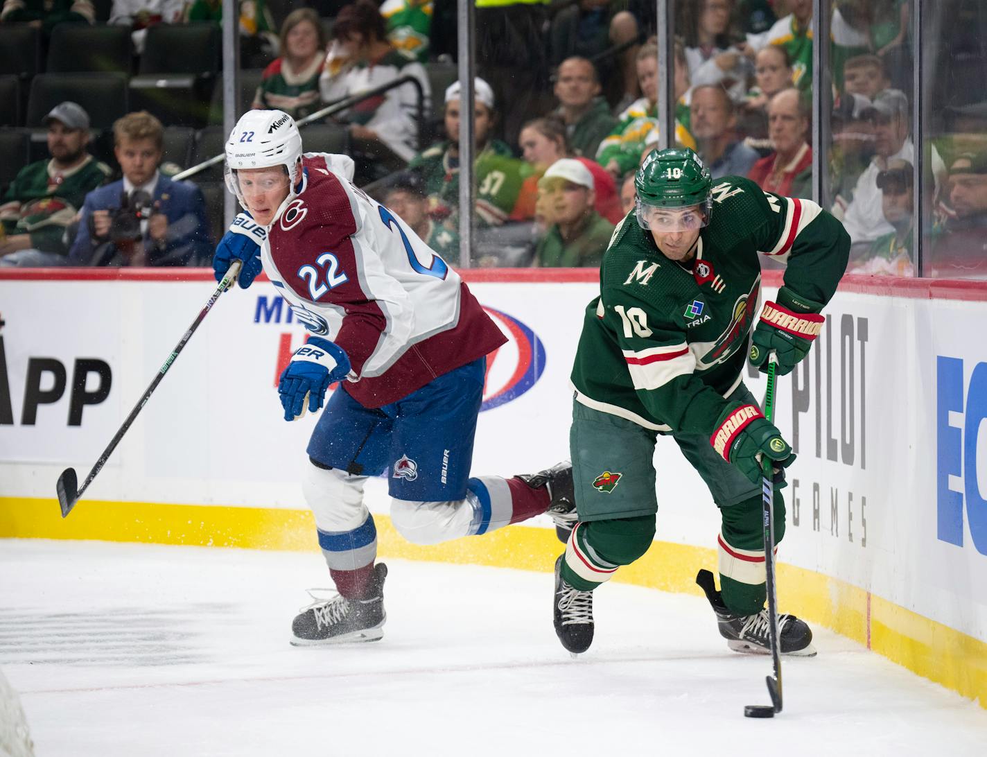 Minnesota Wild forward Vinni Lettieri (10) looks for a teammate to pass to after winning the puck from Colorado Avalanche center Fredrik Olofsson (22) during the first period of a preseason NHL hockey game Thursday, Sept. 28, 2023, in St. Paul, Minn. (Jeff Wheeler/Star Tribune via AP)