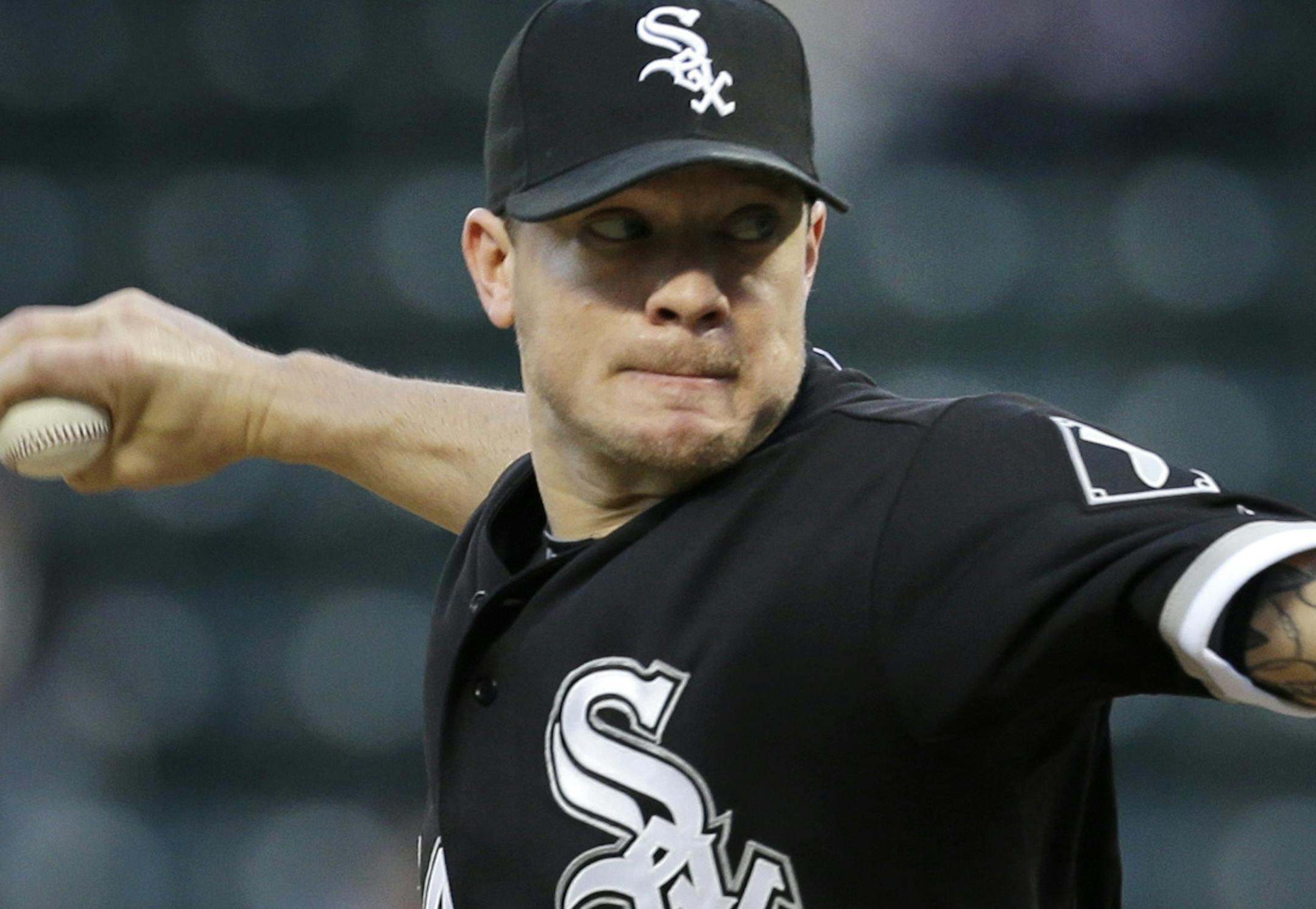 Chicago White Sox starting pitcher Jake Peavy winds up during the first inning of a baseball game against the New York Mets on Wednesday, May 8, 2013, in New York. (AP Photo/Seth Wenig)